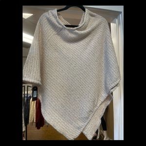 Winter white poncho with silver metallic accent weave